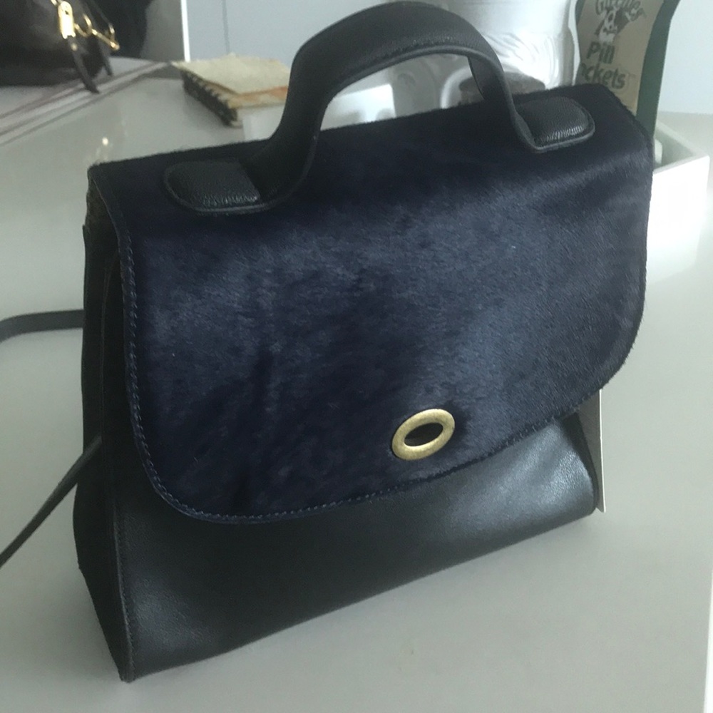Anthropologie black handbag with faux navy fur